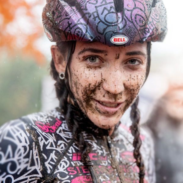 All Kids Bike ambassador Sammi Runnels covered in mud after a cyclocross race