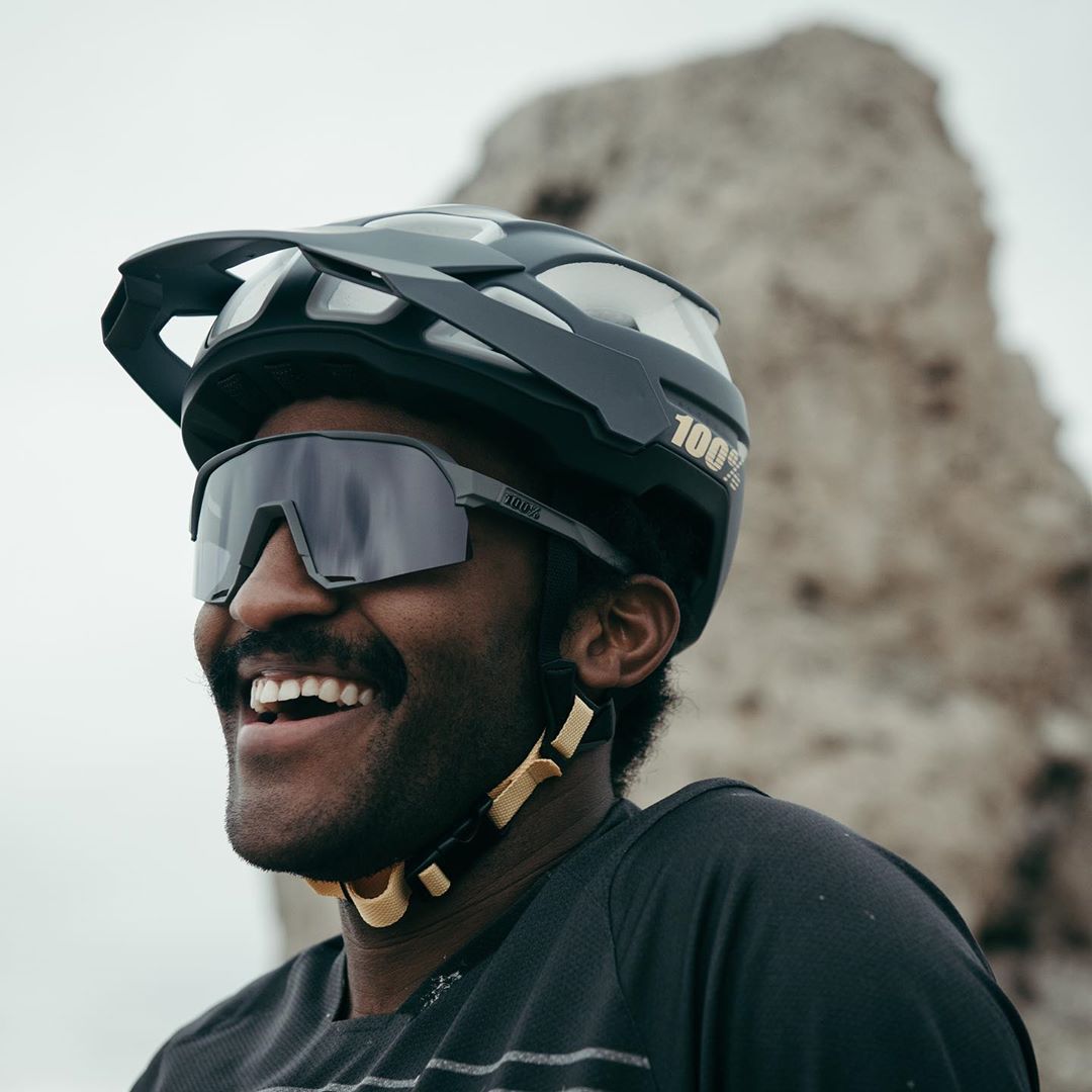 Eliot Jackson takes a break biking near a rocky outcrop