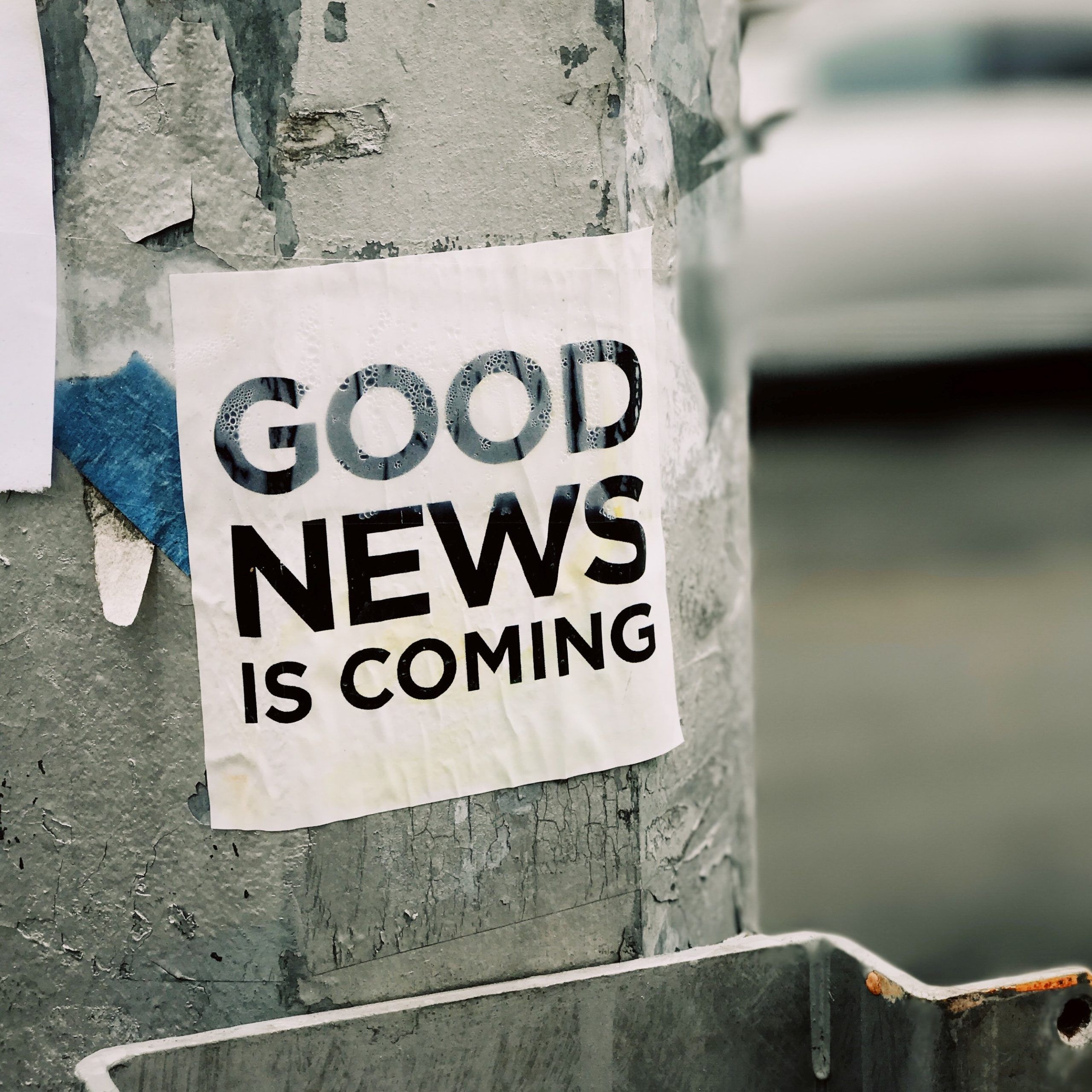 "Good News Is Coming" posted on light post