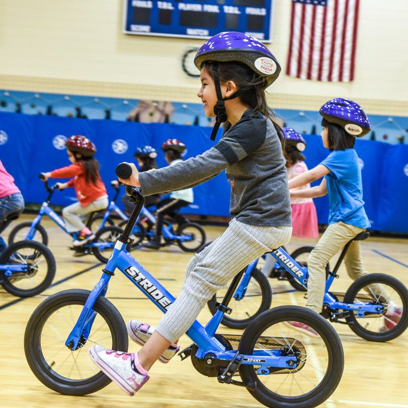 Students riding 14x Sport bikes in PE class