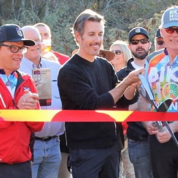 All Kids Bike National Ambassador cutting a ribbon