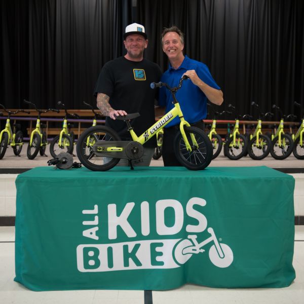 All Kids Bike Ambassador Jody Perewitz at a sunny marina.