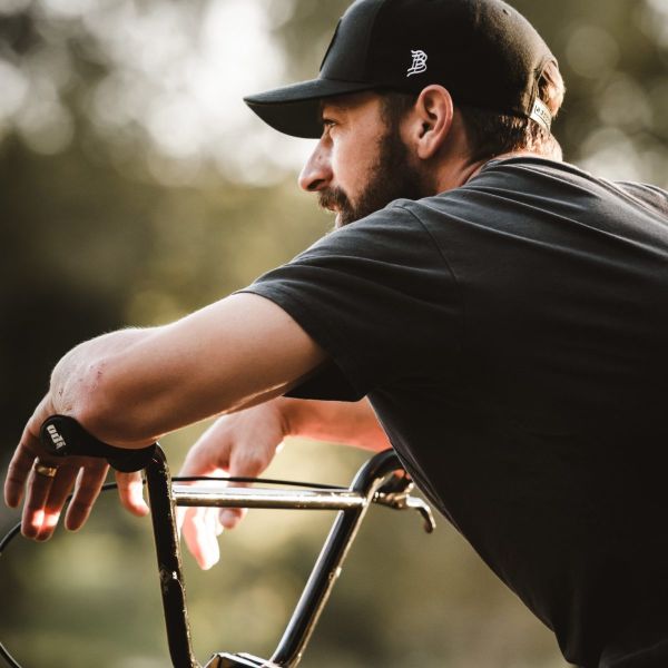 James Carter posing over handlebars of his BMX bike