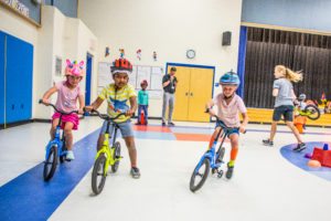 Learning to cycle at Lady Octavia. Progression to pedalling their