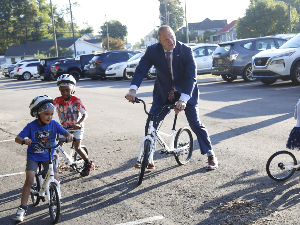 Mayor Glenn Jacobs riding bikes with Knoxville kinder students